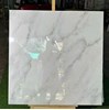 Đá đồng chất khắc kim Trung Quốc 100x100 trắng vân khói mờ